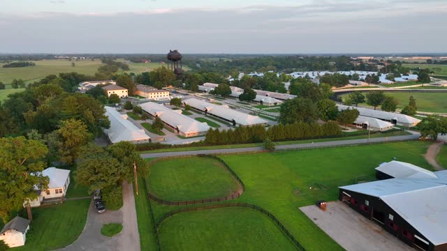 Horse farm in Kentucky during summer. Aerial view of barns and equestrian farm in USA.