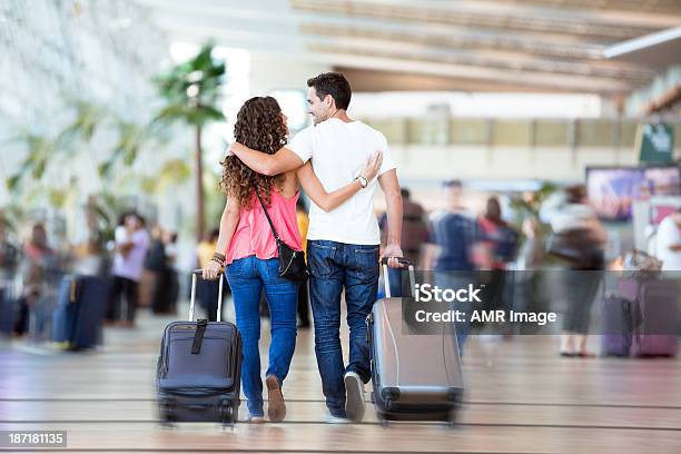 Couple With Suitcases Inside Airport Stock Photo - Download Image Now - Couple - Relationship, Airport, Flying