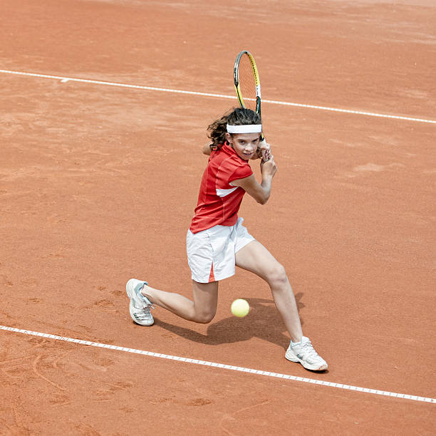 Young tennis player in action