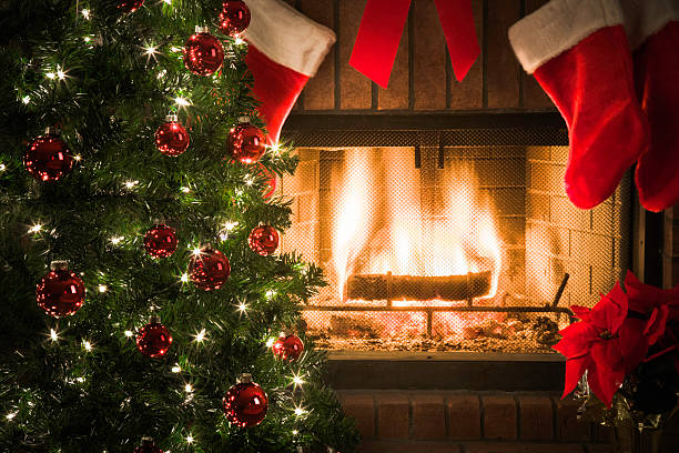 istock Christmas tree, stockings, decor, around cozy fireplace with blazing fire 187182749