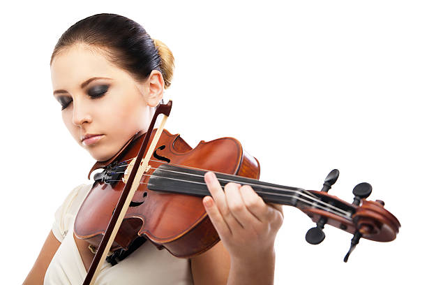 istock Beautiful young woman playing violin over white 187182905