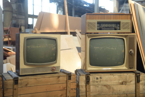 istock Two old TVs are in the hangar. Retro technology concept. 1871846345