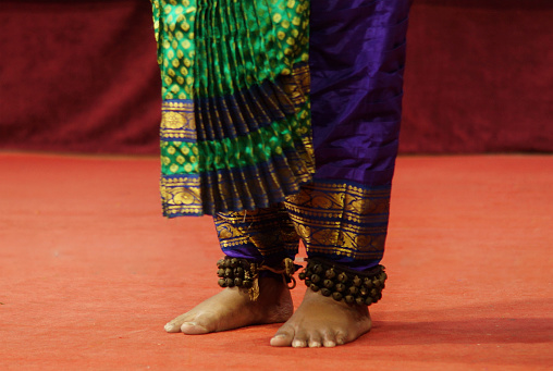 View of Indian woman perform traditional bharatanatyam dance