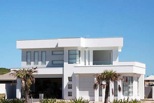 istock New modern white house against blue sky, copy space 187185284