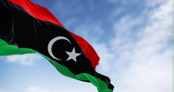 istock National flag of Libya waving on a clear day 1871855373