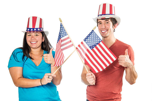 istock Diverse Couple with American Flags  Isolated on White 187185776