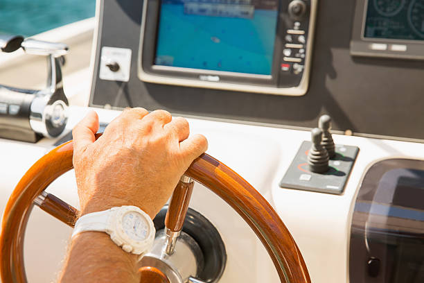 istock Man driving the yacht 187185811