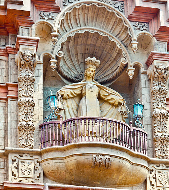 Statue of Madonna standing on a balcony of church facade, Lima, Peru.