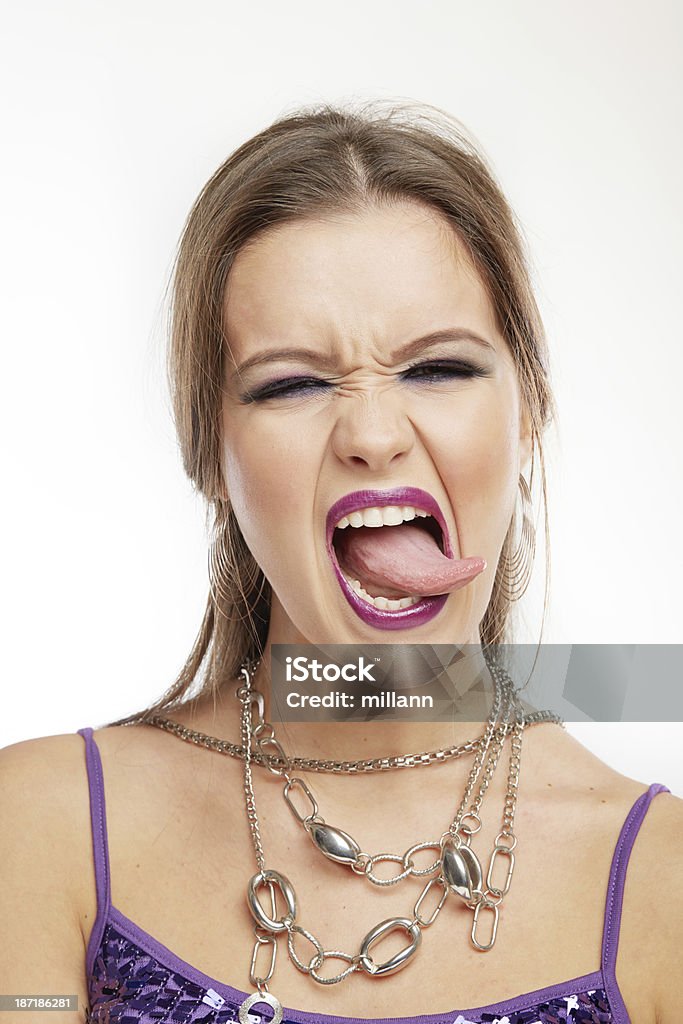 Femme faisant des visages: Lick - Photo de Adulte libre de droits