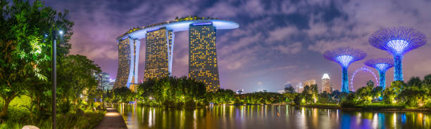 Singapore Marina Bay Sands iconic hotel illuminated at night panorama stock photo