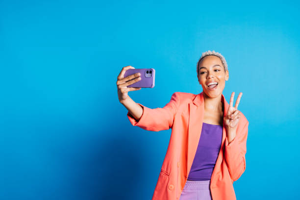 istock Woman in a studio taking a selifie 1871869566
