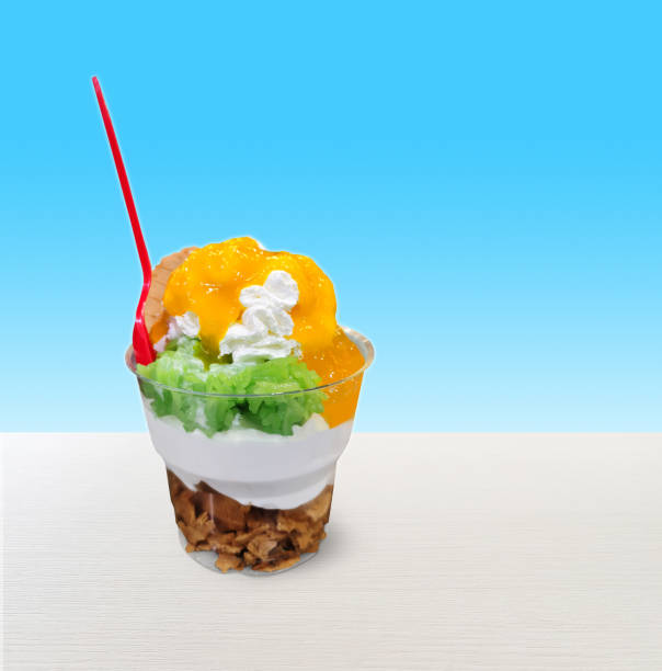 istock Ice cream in a glass isolated on a white table  blue background 1871873235