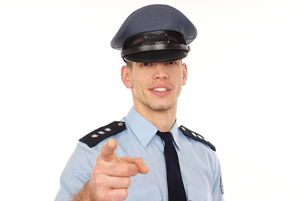 istock Smiling policeman shows on you. 187187982
