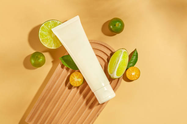 istock An unlabeled cosmetic tube is placed on a dome-shaped platform, surrounded by lemons and kumquats. These are two fruits rich in vitamin C that are good for the body. 1871881132