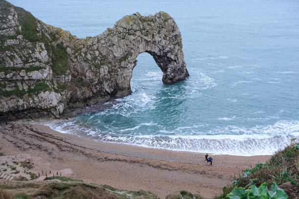 Durdle Door limestone arch on the Jurassic Coast in Dorset. Natural landmark. England. Pure clean clear water