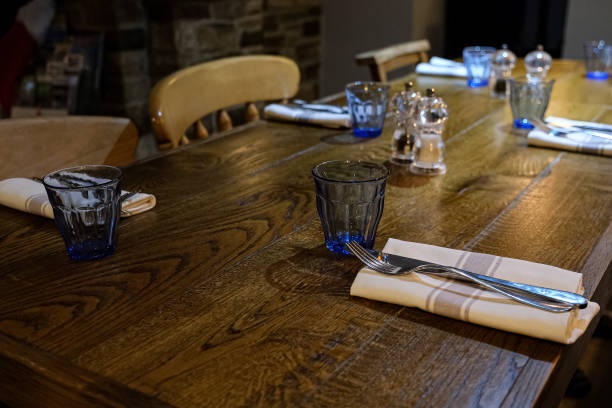 istock View of the wooden table set for dinner in a pub. 1871912443