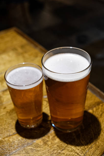 istock Half pint and pint of lager beer 1871912444