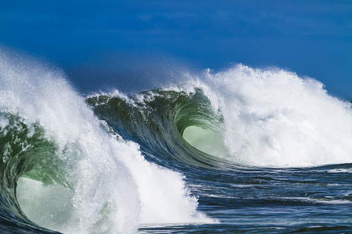 Big waves and barrels breaking on the North Shore of Oahu, Hawaii. Home of surfing.