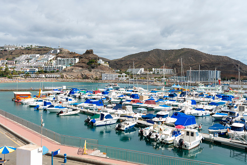 View of sea port and small bay of Puerto Rico de Gran Canaria holiday resort. Gran Canaria island, Spain
