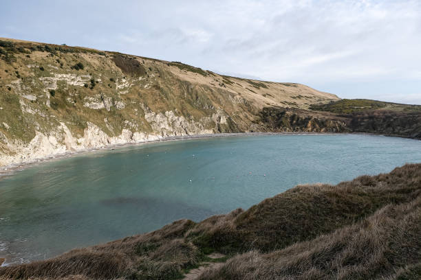 istock Lulworth Cove and beach view at winter day 1871938776