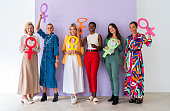 Group of beautiful confident women holding the femininity Venus symbol