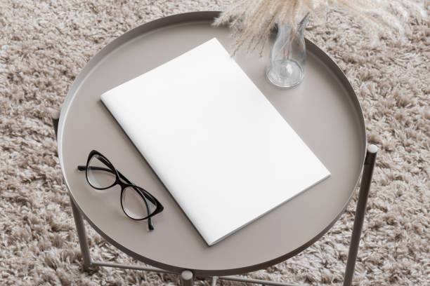 istock Magazine mockup with a pampas on the beige table. 1871960304