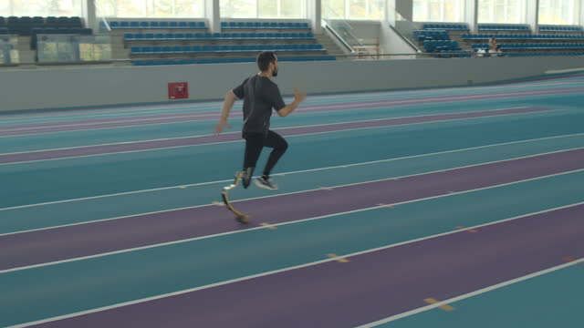Sportsman Running on Blade at Indoor Stadium