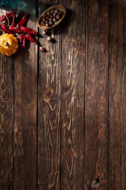 istock Rustic wooden surface featuring autumn harvest accents, perfect for fall season compositions, with a top-down perspective and space for text 1871989347