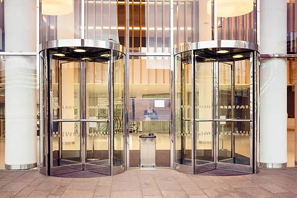 Photo of Office building set of modern revolving doors