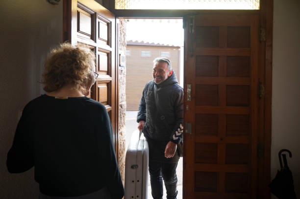 istock A physical therapist arriving at a client's home to perform a home massage. 1872000796