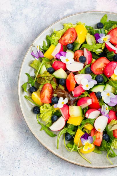 istock Vegetable salad decorated with flowers. 1872002330