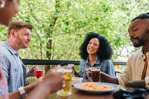 istock Friends talking at bar or restaurant 1872003911