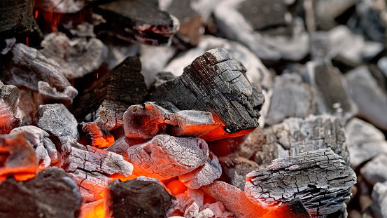 Close-Up of charcoal burning in barbecue grill.