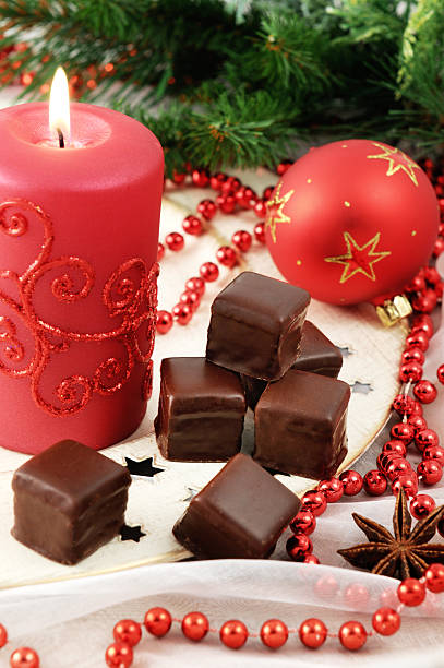 chocolate sweets domino on plate with christmas decoration