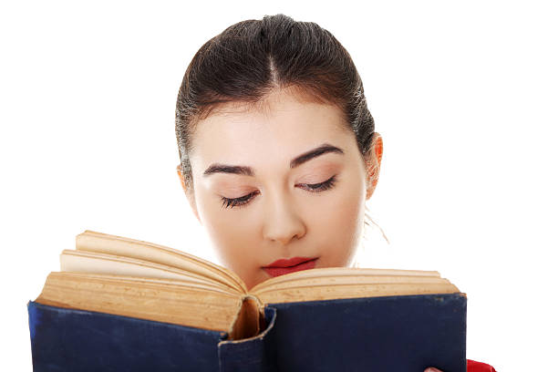 istock Attractive woman reading a book. Closeup. 187201830