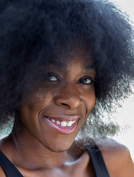 istock Young Black Woman with Afro - Close up 187202369