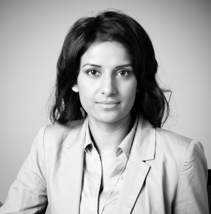 Head and shoulders portrait of an asian businesswoman in a suit. Black and white business headshot of mid adult woman in her 30's.