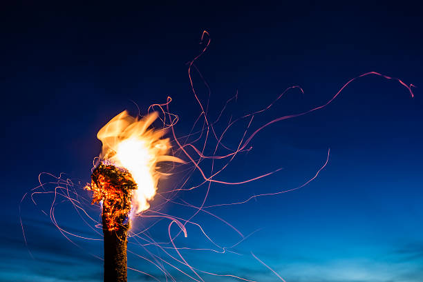 Flaming Torch at Night stock photo