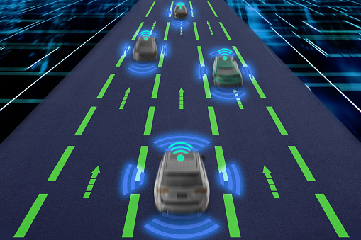 Embark on a journey into the future of transportation with this high-tech image that vividly illustrates autonomous vehicles communicating on a smart highway. Highlighting the synergy between advanced vehicular technology and connected infrastructure