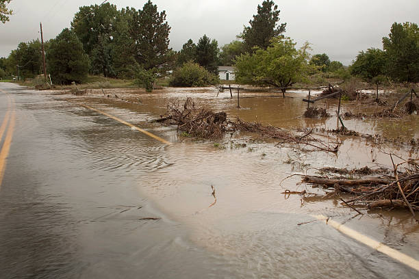 istock Colorado flooding road and home copy space 187205571