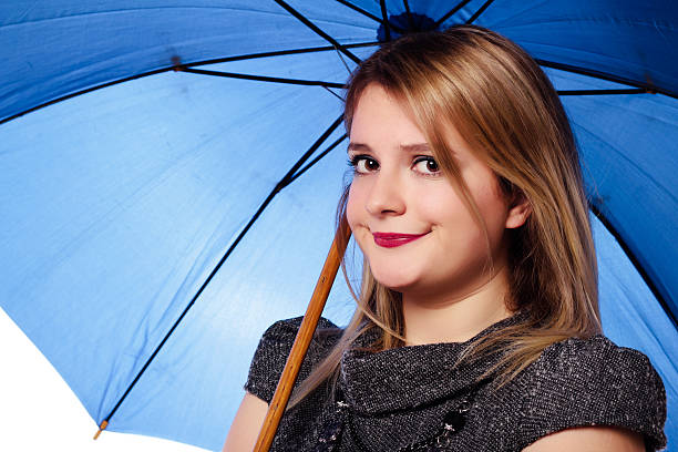 istock Young woman with a umbrella - Stock Image 187205635