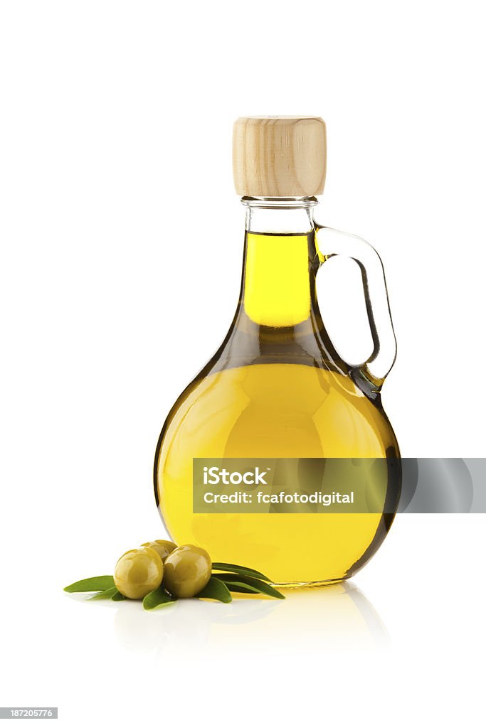 Olive oil contained in an round shaped bottle Olive Oil Bottle and Olives Isolated on White Background Olive Oil Stock Photo
