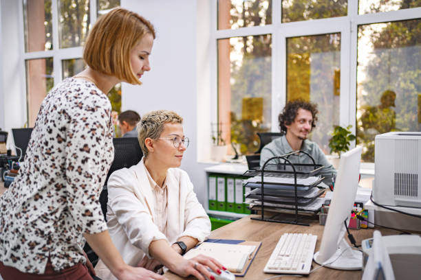 istock Three business coworkers working at the office 1872067343