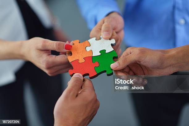 Group Of Business People Assembling Jigsaw Puzzle Stock Photo - Download Image Now - Abstract, Adult, Backgrounds