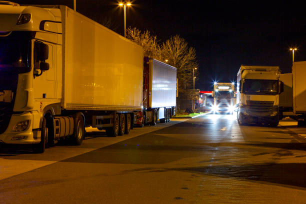 istock Trucks, rest area at night - long exposure 1872108652