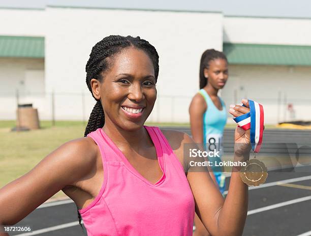 Confident Woman Medalist Stock Photo - Download Image Now - Medal, Sports Track, Adult