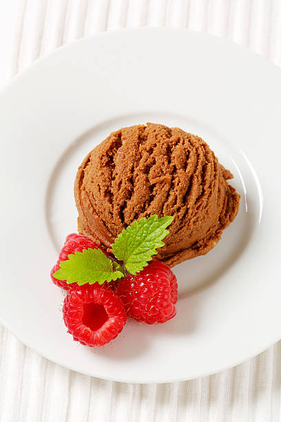 istock Scoop of chocolate ice cream with ripe raspberries 187213068