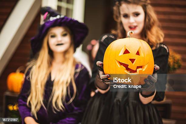 Young Vampire And Witch Dressed Up For Halloween Stock Photo - Download Image Now - 12-13 Years, Autumn, Beautiful People