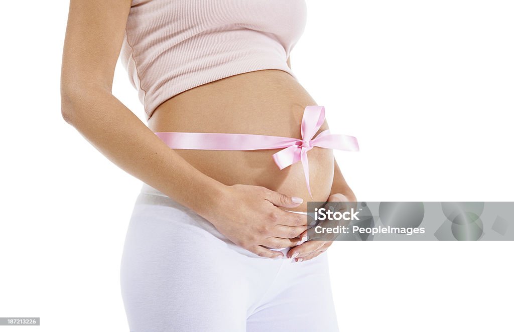 Affectionately wrapped A pregnant woman with a ribbon wrapped around her stomach Abdomen Stock Photo