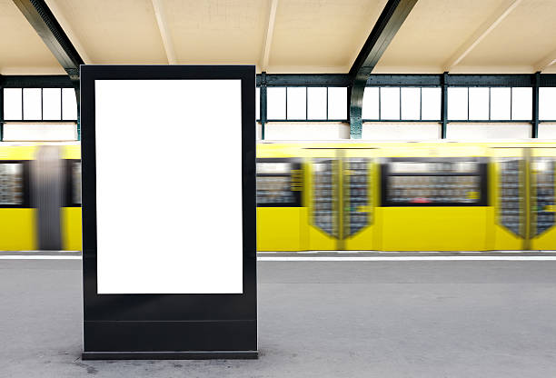 Blank Billboard on a metro station / Berlin Blank Billboard on a metro station / Berlin - Clipping path included subway platform stock pictures, royalty-free photos & images